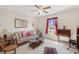 Living room with floral sofa, coffee table, and decorative rug at 17385 Se 110Th Ter, Summerfield, FL 34491