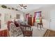 Cozy living room featuring floral sofa and wooden accents at 17385 Se 110Th Ter, Summerfield, FL 34491