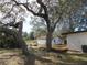 Large oak trees and a wooden deck at 18782 Se 50Th St, Ocklawaha, FL 32179