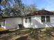 Side view of a single story home with air conditioning unit at 18782 Se 50Th St, Ocklawaha, FL 32179