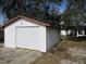 Detached single car garage with automatic door at 18782 Se 50Th St, Ocklawaha, FL 32179