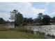 Another view of the lake with lush vegetation at 18782 Se 50Th St, Ocklawaha, FL 32179