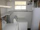 Laundry room with washer, dryer, and ample shelving at 18782 Se 50Th St, Ocklawaha, FL 32179