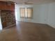 Simple living room with stone fireplace and ceiling fan at 18782 Se 50Th St, Ocklawaha, FL 32179