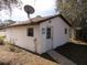 White storage shed with satellite dish and small walkway at 18782 Se 50Th St, Ocklawaha, FL 32179