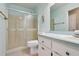 Updated bathroom with walk-in shower and vanity at 1904 Tweed Ct, Leesburg, FL 34788