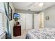 Bright bedroom featuring a double bed and built-in closet at 1904 Tweed Ct, Leesburg, FL 34788