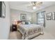 Charming bedroom with floral bedding and a window at 1904 Tweed Ct, Leesburg, FL 34788