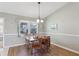 Bright dining area with wood table and chairs, offering a space for casual meals at 1904 Tweed Ct, Leesburg, FL 34788