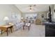 Living room with floral sofa, coffee table, and two armchairs at 1904 Tweed Ct, Leesburg, FL 34788