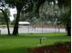 Community tennis court with green space at 1904 Tweed Ct, Leesburg, FL 34788