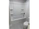 Clean bathroom featuring a tub-shower combo with built in shelving at 2210 Nw 23Rd Loop, Ocala, FL 34475
