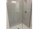 Beautiful bathroom with a glass enclosed shower and tiled walls at 2210 Nw 23Rd Loop, Ocala, FL 34475