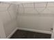 A walk-in closet provides ample storage with its wire shelving and neutral color scheme at 2210 Nw 23Rd Loop, Ocala, FL 34475