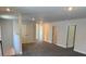 This hallway features multiple doors and access to the upper level and bedrooms at 2210 Nw 23Rd Loop, Ocala, FL 34475