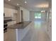 Open concept kitchen with island that connects to the spacious dining room at 2210 Nw 23Rd Loop, Ocala, FL 34475