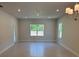 Open living room with recessed lighting, a chandelier, and large windows for ample natural light at 2210 Nw 23Rd Loop, Ocala, FL 34475