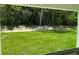 Backyard view with green grass at 2214 Nw 23Rd Loop, Ocala, FL 34475
