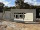 Image shows the cinder block structure of a residential home under construction on a dirt lot at 2214 Nw 23Rd Loop, Ocala, FL 34475