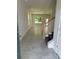 Inviting entryway featuring a staircase, neutral tile flooring, and an open floor plan at 2214 Nw 23Rd Loop, Ocala, FL 34475