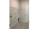 Convenient laundry room with tile flooring, washer/dryer hookups, and storage shelf at 2214 Nw 23Rd Loop, Ocala, FL 34475