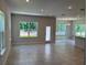 Open concept living area with tile floors, natural light, and neutral paint at 2214 Nw 23Rd Loop, Ocala, FL 34475