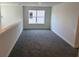 Cozy loft area with soft gray carpeting, offering a versatile space for relaxation or entertainment at 2214 Nw 23Rd Loop, Ocala, FL 34475