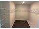 Empty walk-in closet with shelving. Ready for organizing and ample storage at 2214 Nw 23Rd Loop, Ocala, FL 34475