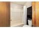 Bathroom with tub, shower, and dark wood cabinet at 2701 Ne 10Th St # 707, Ocala, FL 34470