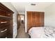 Bedroom with large closet and view into hallway at 2701 Ne 10Th St # 707, Ocala, FL 34470