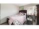 Bedroom with a floral bedspread and a small dresser at 2701 Ne 10Th St # 707, Ocala, FL 34470