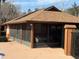 Screened community pool pavilion with tables and chairs at 2701 Ne 10Th St # 707, Ocala, FL 34470