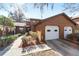 Front view of a two-story townhome with double garage at 2701 Ne 10Th St # 707, Ocala, FL 34470