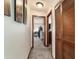 Home hallway with carpet, wood doors, and artwork at 2701 Ne 10Th St # 707, Ocala, FL 34470