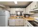 Well-lit kitchen with white cabinets and wood countertops at 2701 Ne 10Th St # 707, Ocala, FL 34470