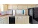 Kitchen boasts built-in dishwasher and cabinets at 43 Lake Court Loop, Ocala, FL 34472