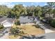 Aerial view of a house, yard, and neighboring properties at 43 Teak Crse, Ocala, FL 34472