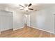 Well-lit bedroom featuring wood-look floors and a ceiling fan at 43 Teak Crse, Ocala, FL 34472