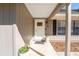 Front entryway with a white door and potted plants at 43 Teak Crse, Ocala, FL 34472