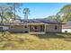 Ranch house with screened porch and yard at 43 Teak Crse, Ocala, FL 34472