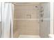 Clean shower with tile surround and built-in seat at 43 Teak Crse, Ocala, FL 34472