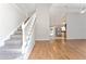 Interior view of a carpeted staircase and hardwood floors at 43 Teak Crse, Ocala, FL 34472