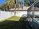 Landscaped backyard with a wooden fence and birdhouse at 4517 Se 28Th St, Ocala, FL 34480