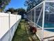 Landscaped backyard with fenced enclosure and pool at 4517 Se 28Th St, Ocala, FL 34480