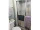 Bathroom with shower, toilet and linen storage at 4517 Se 28Th St, Ocala, FL 34480