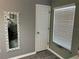 Bathroom with a large mirror, door to closet, and window with blinds at 4517 Se 28Th St, Ocala, FL 34480