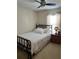 Bedroom with a metal bed frame and ceiling fan at 4517 Se 28Th St, Ocala, FL 34480