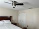 Bedroom with double doors and ceiling fan at 4517 Se 28Th St, Ocala, FL 34480