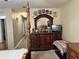 Bedroom with a large dresser, TV, and a four poster bed at 4517 Se 28Th St, Ocala, FL 34480