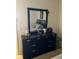 Bedroom with dresser and large mirror at 4517 Se 28Th St, Ocala, FL 34480